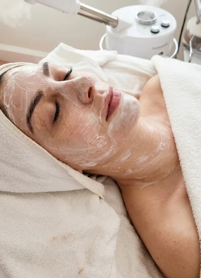 Client receiving a relaxing European facial treatment at Glow Skin Spa