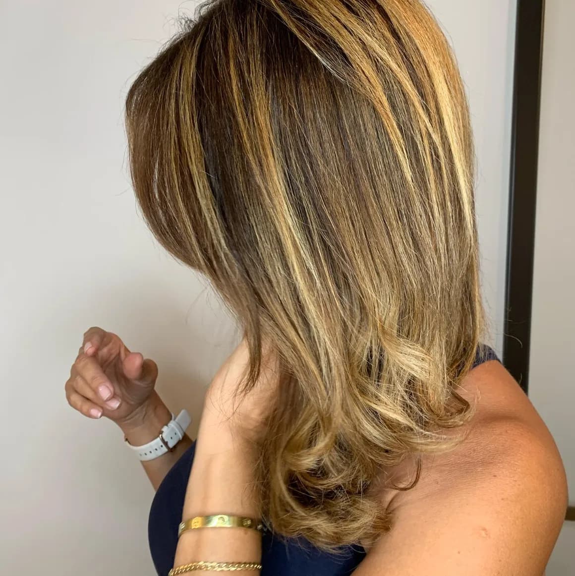 Sleek blowout and polished finish on medium-length hair at Glow Hair Studio